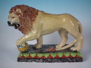 Circa 1780 'Enamel painted figure' of a performing lion. 