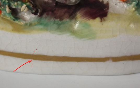 Last to be applied, gilt on Victorian Staffordshire figure lies over the crazing beneath