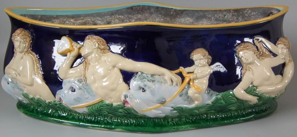 Tritones in support of the sea god Triton.