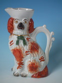 Staffordshire russet spaniel with bow jug/pitcher