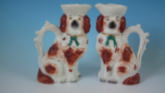 Pair Staffordshire spaniels with bows jug/pitchers