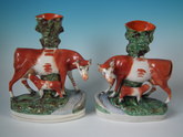 Pair Staffordshire cow with calf spill vases