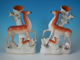 Pair Staffordshire stag&doe with fawns spill vases
