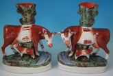 Pair Staffordshire cow & calf spill vases