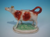Staffordshire russet & white cow creamer