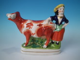 Staffordshire cow & milkmaid creamer
