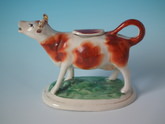 Staffordshire russet & white cow creamer