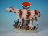 Staffordshire cow & milkmaid spill vase