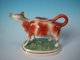 Staffordshire russet & white cow creamer
