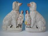 Pair Staffordshire Afghan hound & child figures