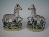 Pair Staffordshire zebra figures