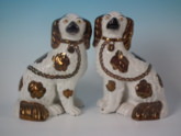 Pair Staffordshire copper lustre spaniels
