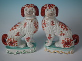 Pair Staffordshire pipe smoking spaniels