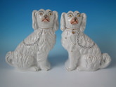 Pair Staffordshire white and gilt spaniels
