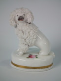 Small Staffordshire poodle & painted flower figure