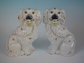 Pair Staffordshire flower basket spaniels