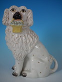 Staffordshire Little Lion Dog holding a fruit basket
