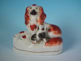 Staffordshire recumbent spaniel with pup figure