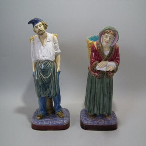 Pair Brownfield Majolica lady & gent with basket figures