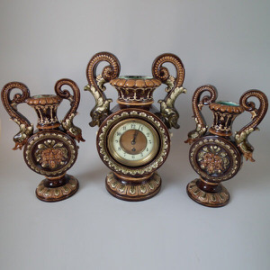 Majolica clock garniture of dolphin handled clock & vases