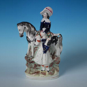 Staffordshire couple & horse figure