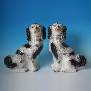Pair Staffordshire pottery spaniels, black & white coats