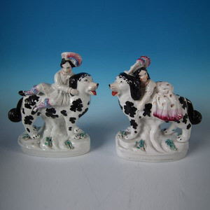 Pair Staffordshire pottery figures of children on Disraeli St. Bernards