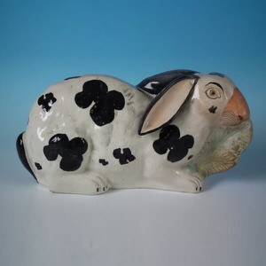 Staffordshire figure of a Rabbit eating lettuce
