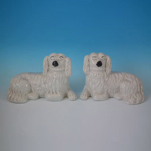 Pair Staffordshire recumbent white & gilt spaniels