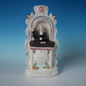 Staffordshire 'Wesley' titled clock group
