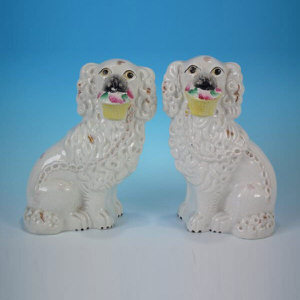 Pair Staffordshire flower basket spaniels