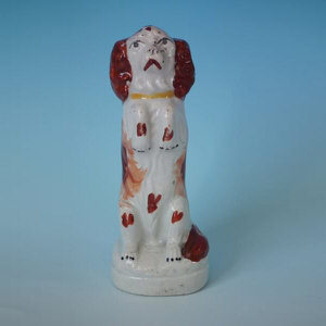 Small Staffordshire pottery begging spaniel figure