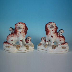 Pair Staffordshire Pottery Spaniels with Pups