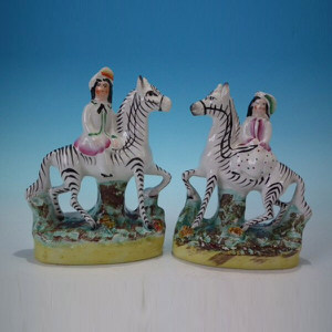 Pair Staffordshire Children on Zebras