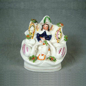 Small Staffordshire boy with swans figure