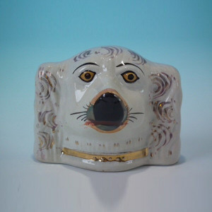 Staffordshire spaniel head money box