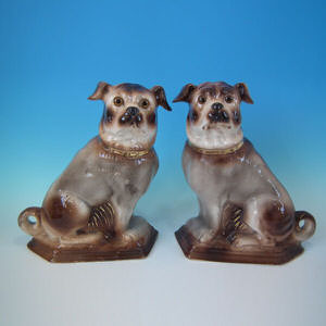 Pair Staffordshire Pugs with glass eyes