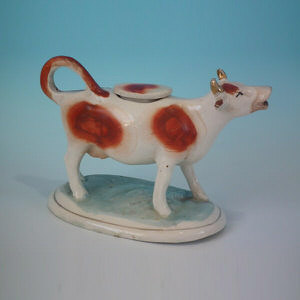 Staffordshire russet & white cow creamer