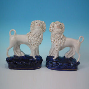 Pair Staffordshire poodles with bird figures