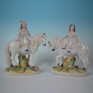 Pair Staffordshire children on horseback figures