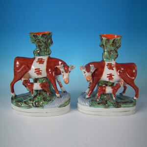 Pair Staffordshire cow & calf spill vases