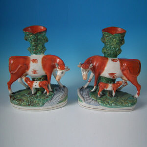 Pair Staffordshire cow with calf spill vases