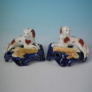 Pair Staffordshire spaniels with hare inkwells
