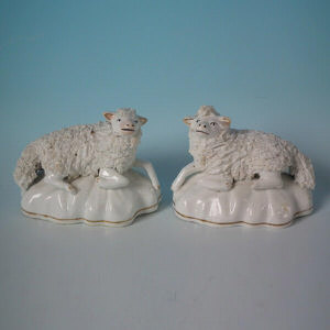 Pair Staffordshire porcellaneous sheep figures