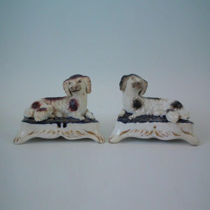 Pair Staffordshire spaniel & pup on cushion inkwell