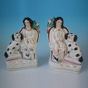 Pair Staffordshire children with spaniel & parrot