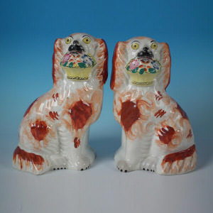 Pair Staffordshire russet flower basket spaniels