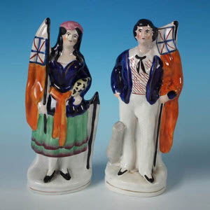 Pair Staffordshire Crimean War sailor & girl figures