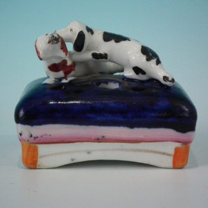 Mini Staffordshire dogs playing on cushion inkwell