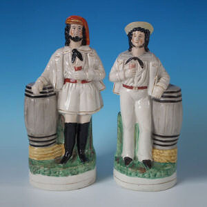 Pair Staffordshire sailor & barrel figures